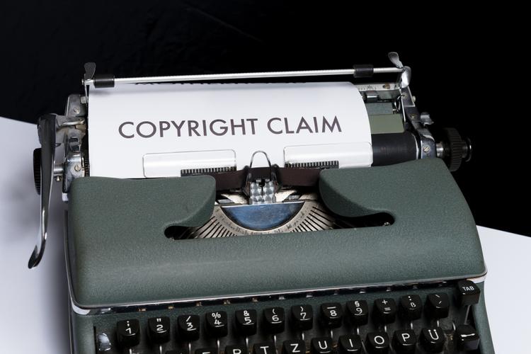 A typewriter with the a copyright claim written on paper